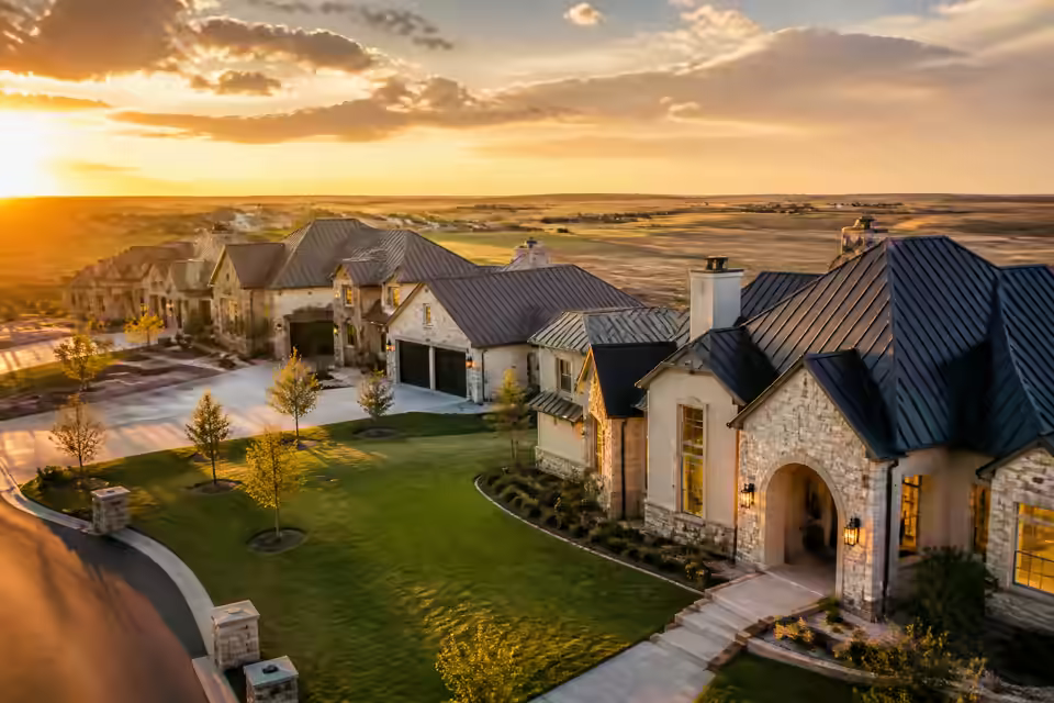 Aerial view of beautiful luxury Texas homes at golden hour in an upscale Panhandle subdivision